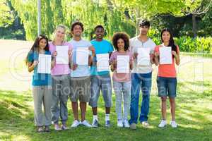 Students holding blank papers