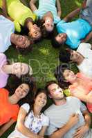 Group of friends lying down in park