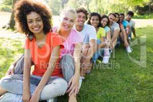 Multiethnic friends sitting in a line