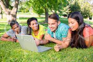 Students using laptop on campus