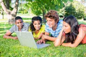 Group of students using laptop