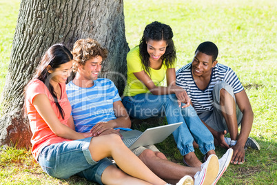 Students using laptop on college campus