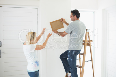 Couple decorating their new house