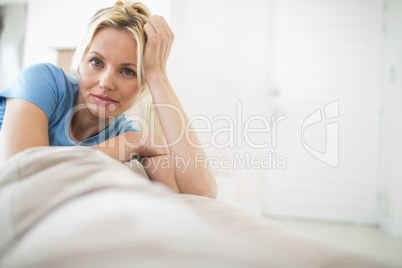 Portrait of a beautiful woman sitting in living room