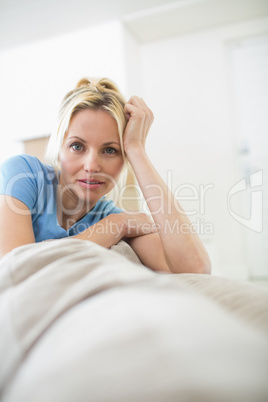 Portrait of a beautiful woman sitting in living room