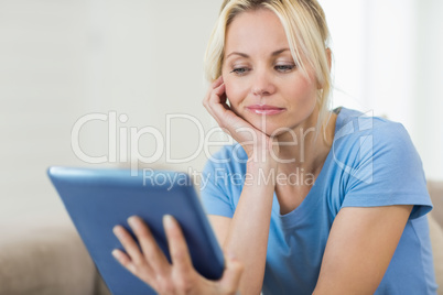 Closeup of a beautiful young woman with digital tablet