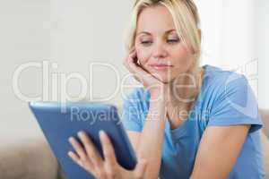 Closeup of a beautiful young woman with digital tablet