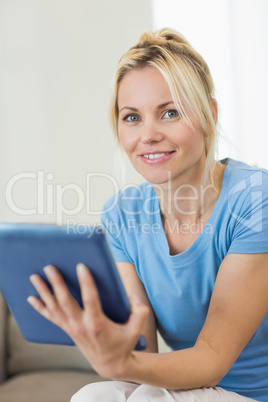 Portrait of a beautiful young woman with digital tablet