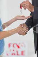 Handshake and passing house key