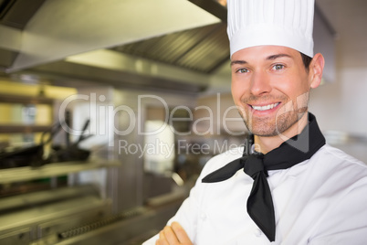 Smiling male cook in the kitchen