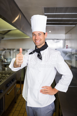 Portrait of a smiling male cook gesturing thumbs