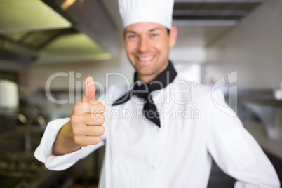 Portrait of a smiling male cook gesturing thumbs up