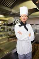 Portrait of confident female cook in kitchen