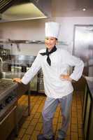 Smiling female cook in the kitchen