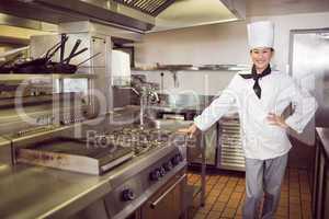 Smiling female cook in the kitchen