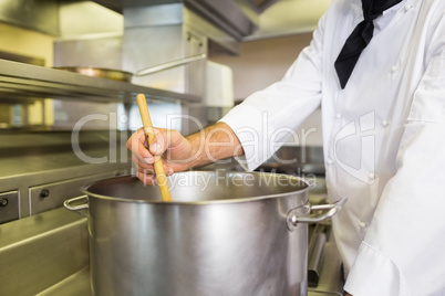 Male chef preparing food in kitchen