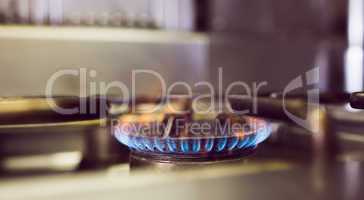 Burning gas on kitchen gas stove
