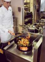 Female chef preparing food in kitchen