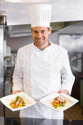 Confident male chef with cooked food in kitchen