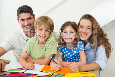 Parents with children drawing at home