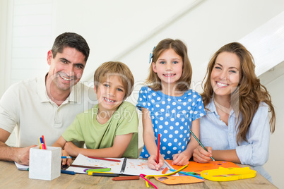 Happy family drawing together