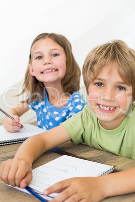 Siblings coloring at table