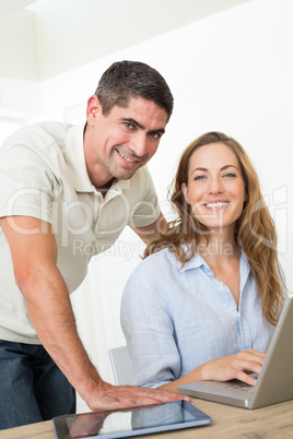 Confident couple using laptop Confident couple using laptop