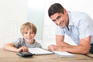 Father assisting son with homework