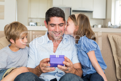 Loving children gifting father