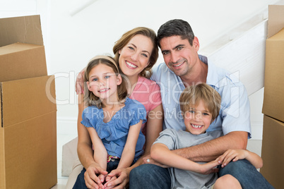 Family sitting in new house