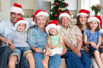 Family in Santa hats celebrating Christmas