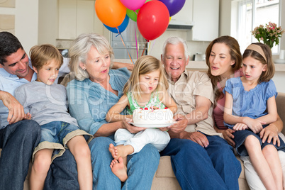 Family celebrating girls birthday