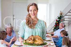 Smiling mother with Christmas meal