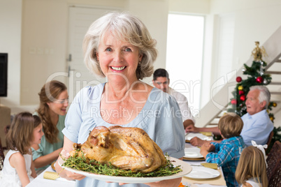 Happy grandmother with Christmas meal