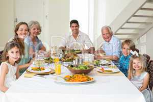 Family having meal together at dining table