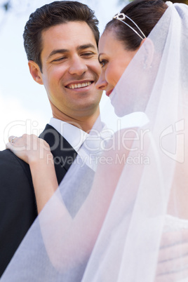 Happy groom looking at bride