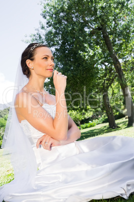 Young bride sitting in garden