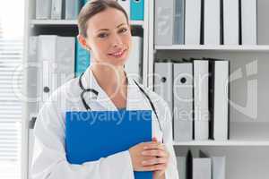 Portrait of female doctor holding folder