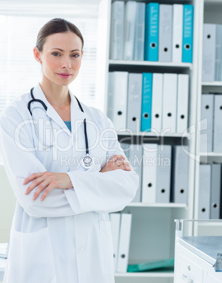 Confident doctor standing arms crossed