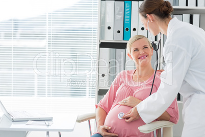 Doctor examining pregnant woman