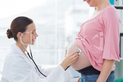 Female doctor examining pregnant woman