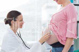 Female doctor examining pregnant woman
