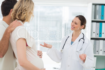 Doctor welcoming expectant couple