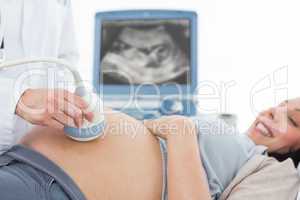 Pregnant woman undergoing ultrasound