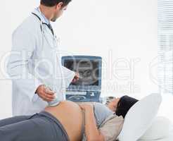 Male doctor performing ultrasound