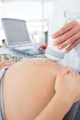 Expectant woman receiving ultrasound