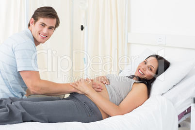 Happy expectant couple in hospital