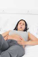 Portrait of pregnant woman suffering from pain