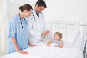 Doctors attending little girl