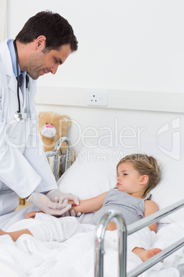 Doctor injecting ill girl